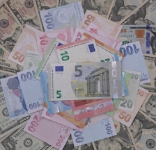 a pile of money sitting on top of each other