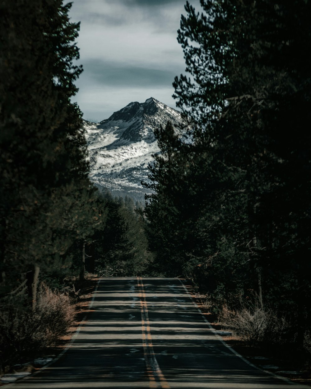 a road with a mountain in the background