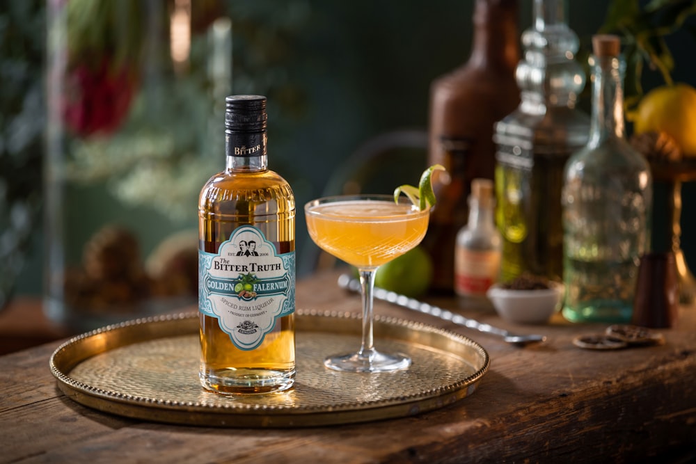 a bottle of alcohol sitting on top of a wooden table