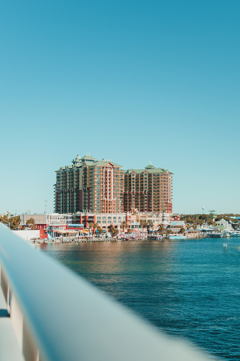 a view of a body of water with buildings in the background