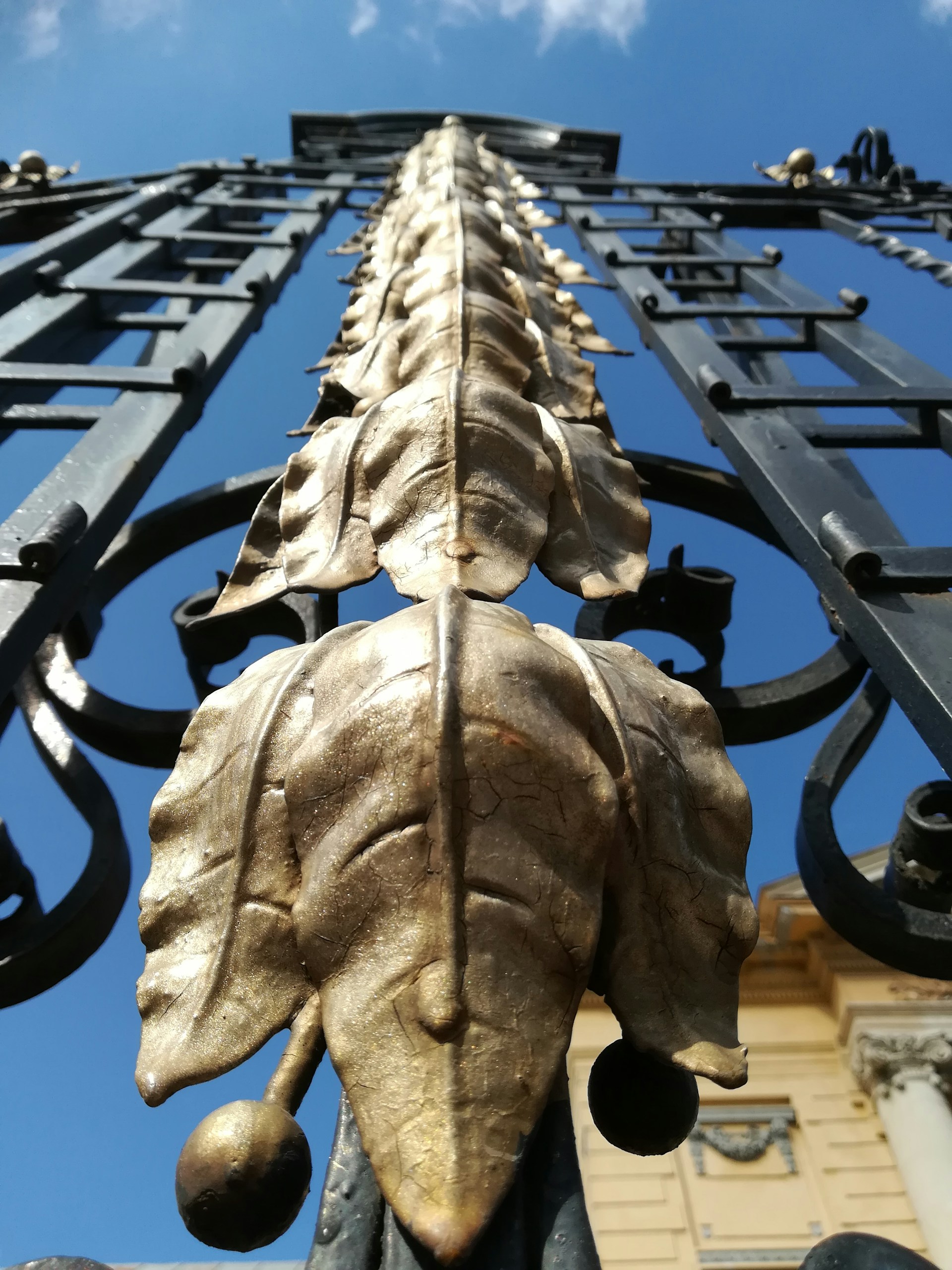 woman wearing yellow long-sleeved dress under white clouds and blue sky during daytime