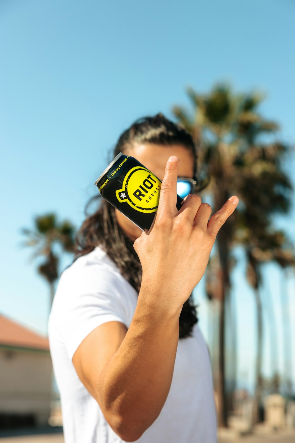 a man holding a cell phone up to his face