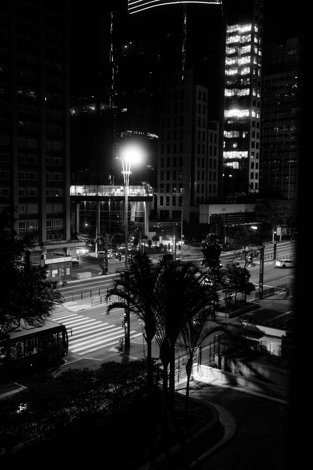 a black and white photo of a city at night