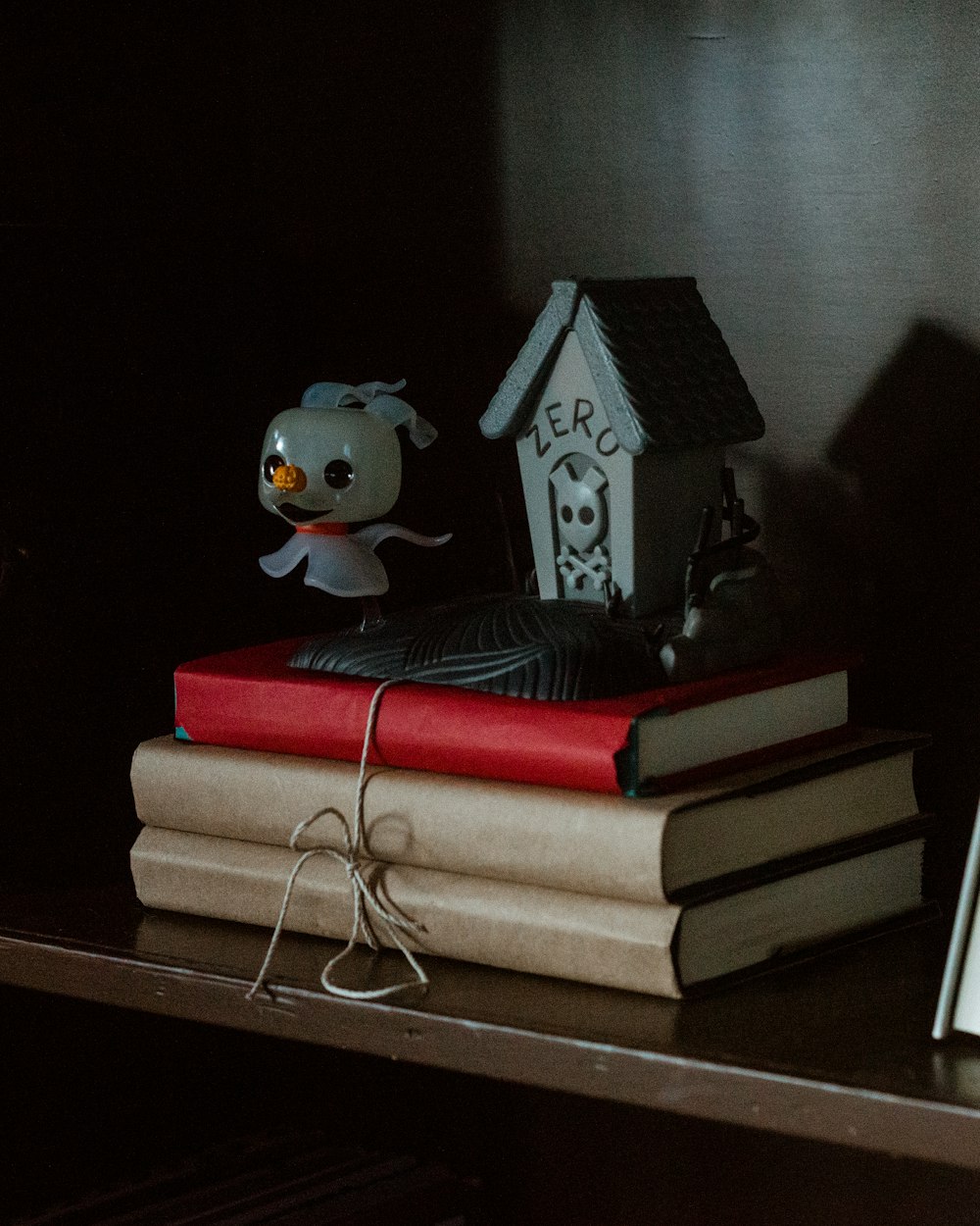 a stack of books sitting on top of a wooden table