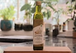 a bottle of garlic oil sitting on top of a counter