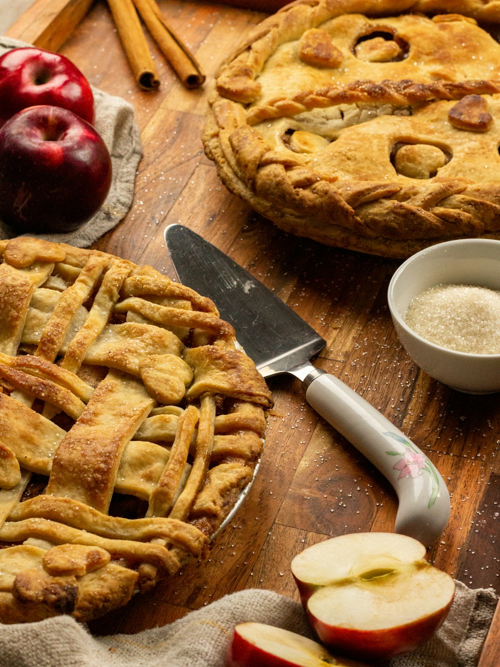an apple pie on a cutting board with a knife