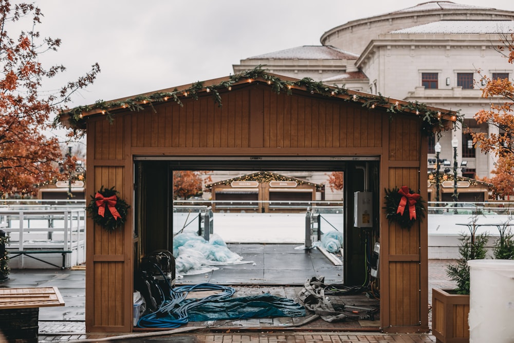 a wooden building with a bunch of decorations on top of it