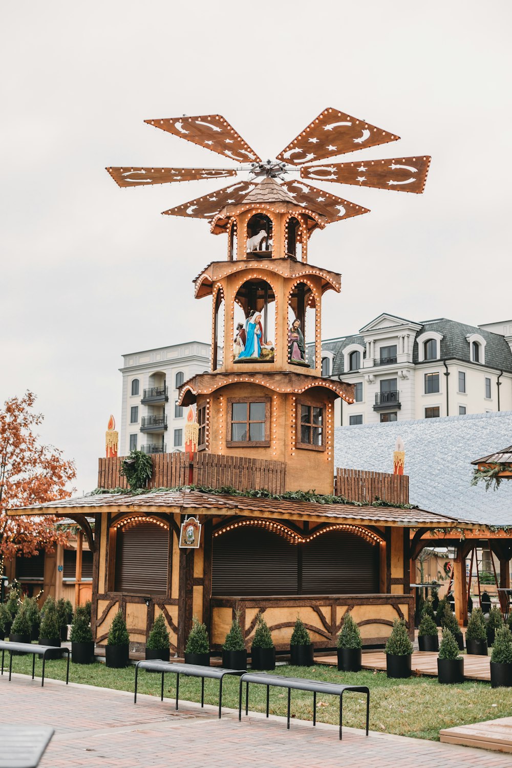 a clock tower with people standing on top of it