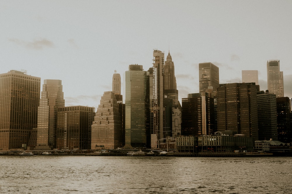 a large body of water with a city in the background