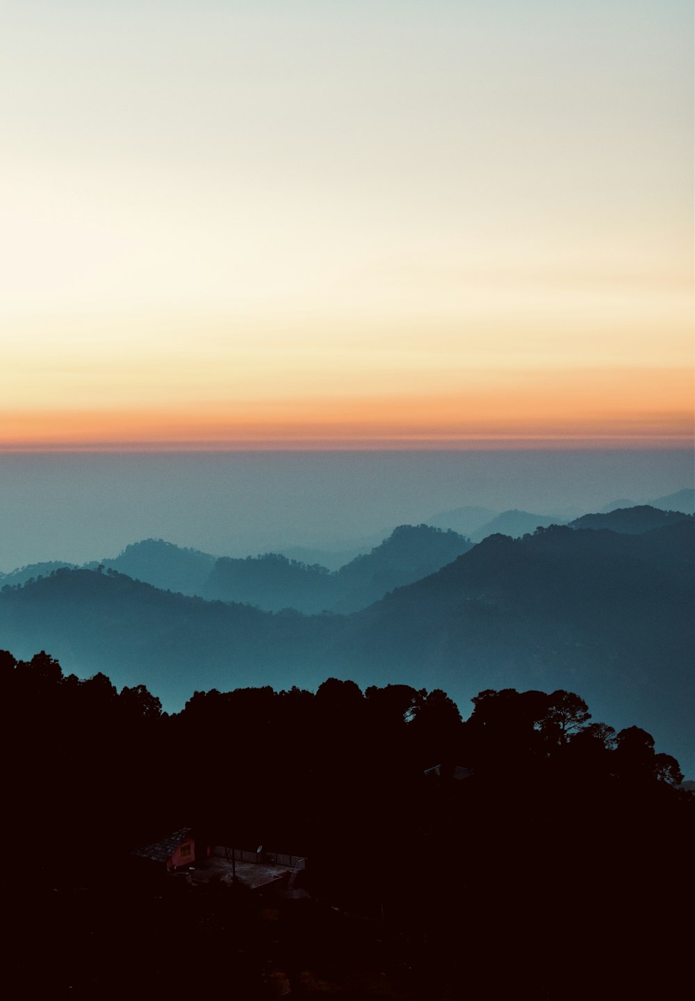 a view of a mountain range at sunset