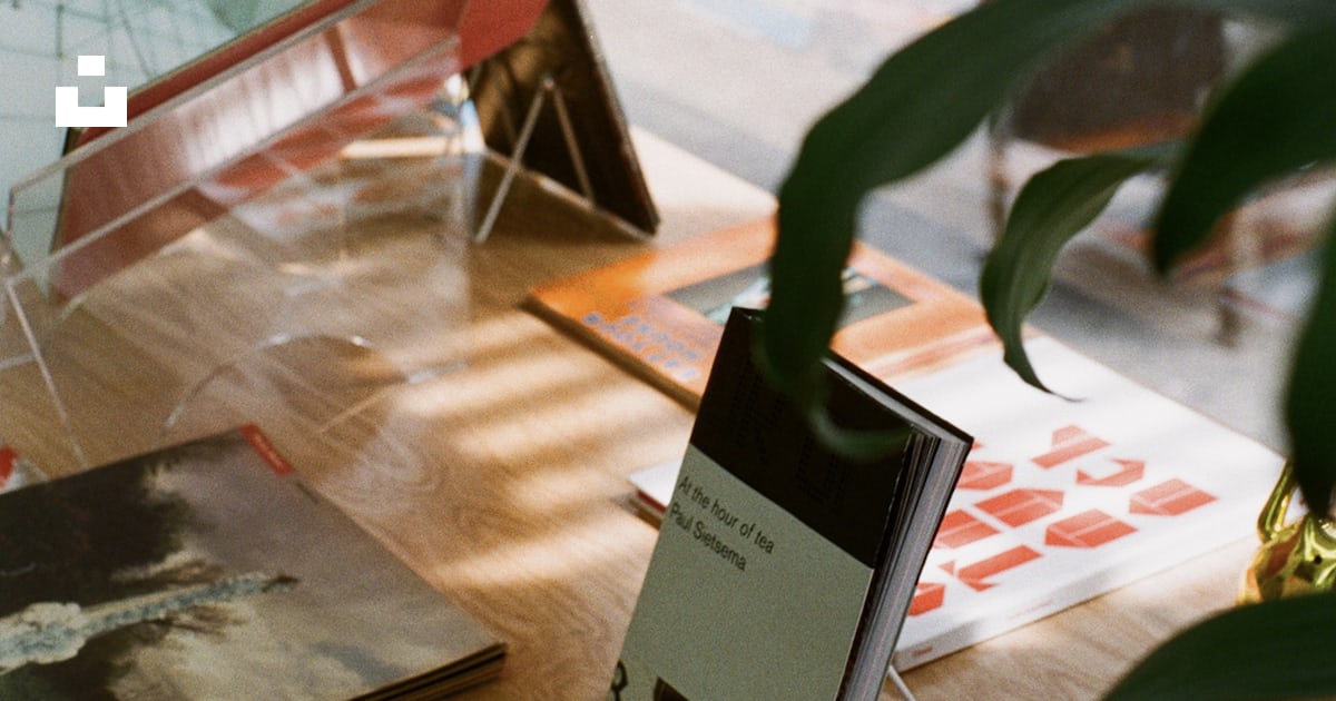 A stack of flyers on a table photo – Free City Image on Unsplash