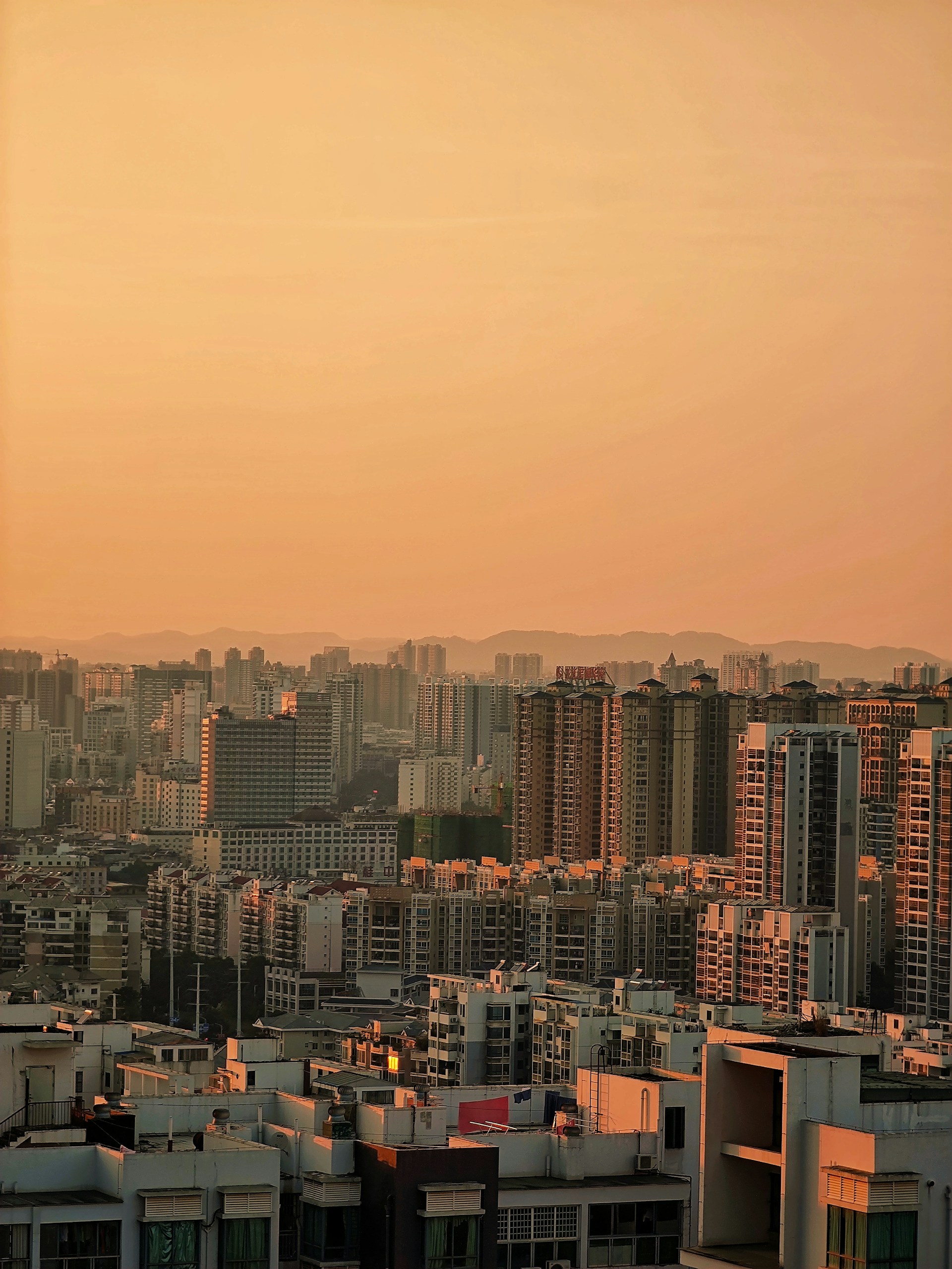 a view of a city with tall buildings