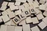 a pile of wooden blocks with the word blog spelled on them