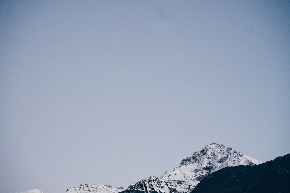 a view of a mountain with snow on it