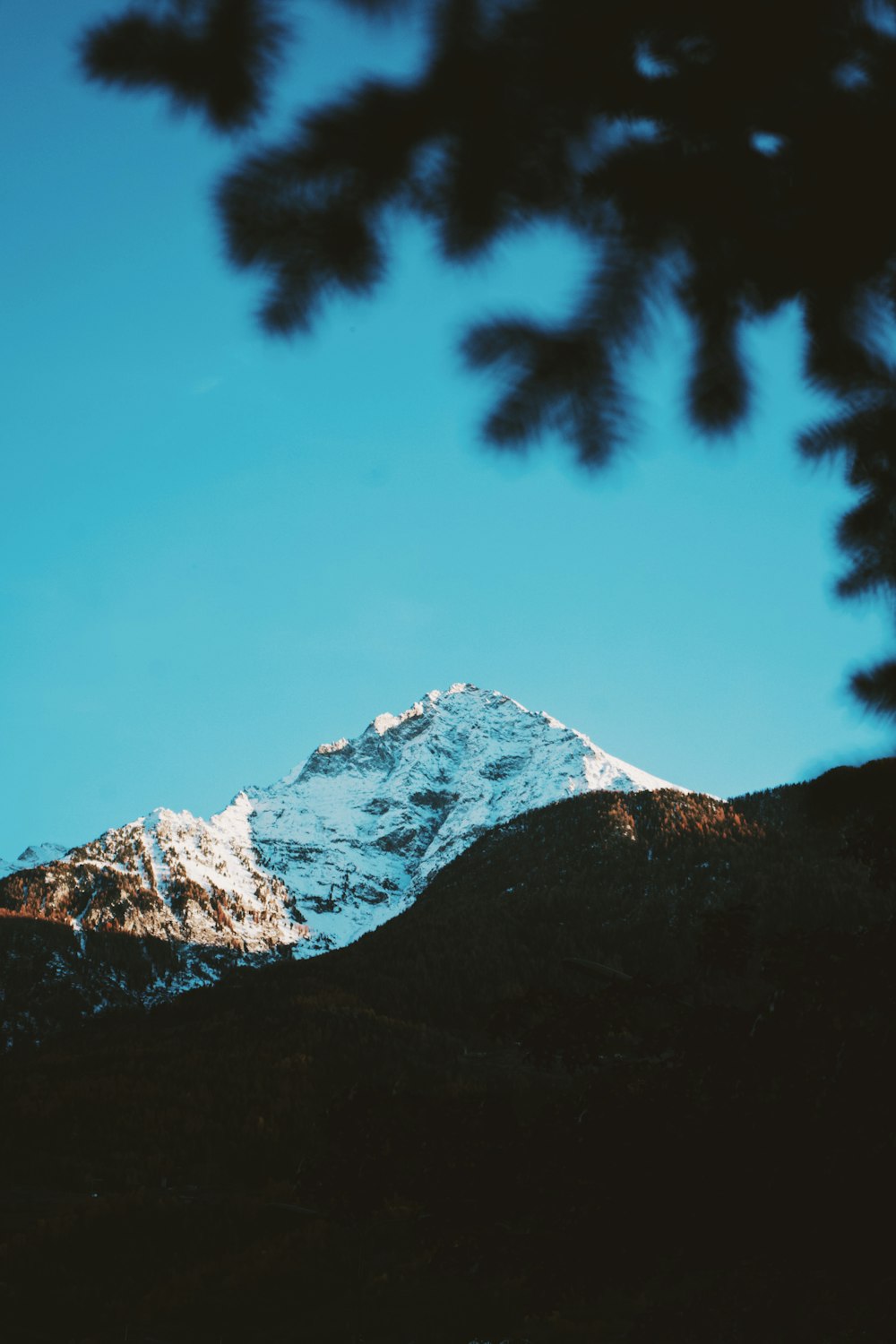 a view of a snow covered mountain from a distance