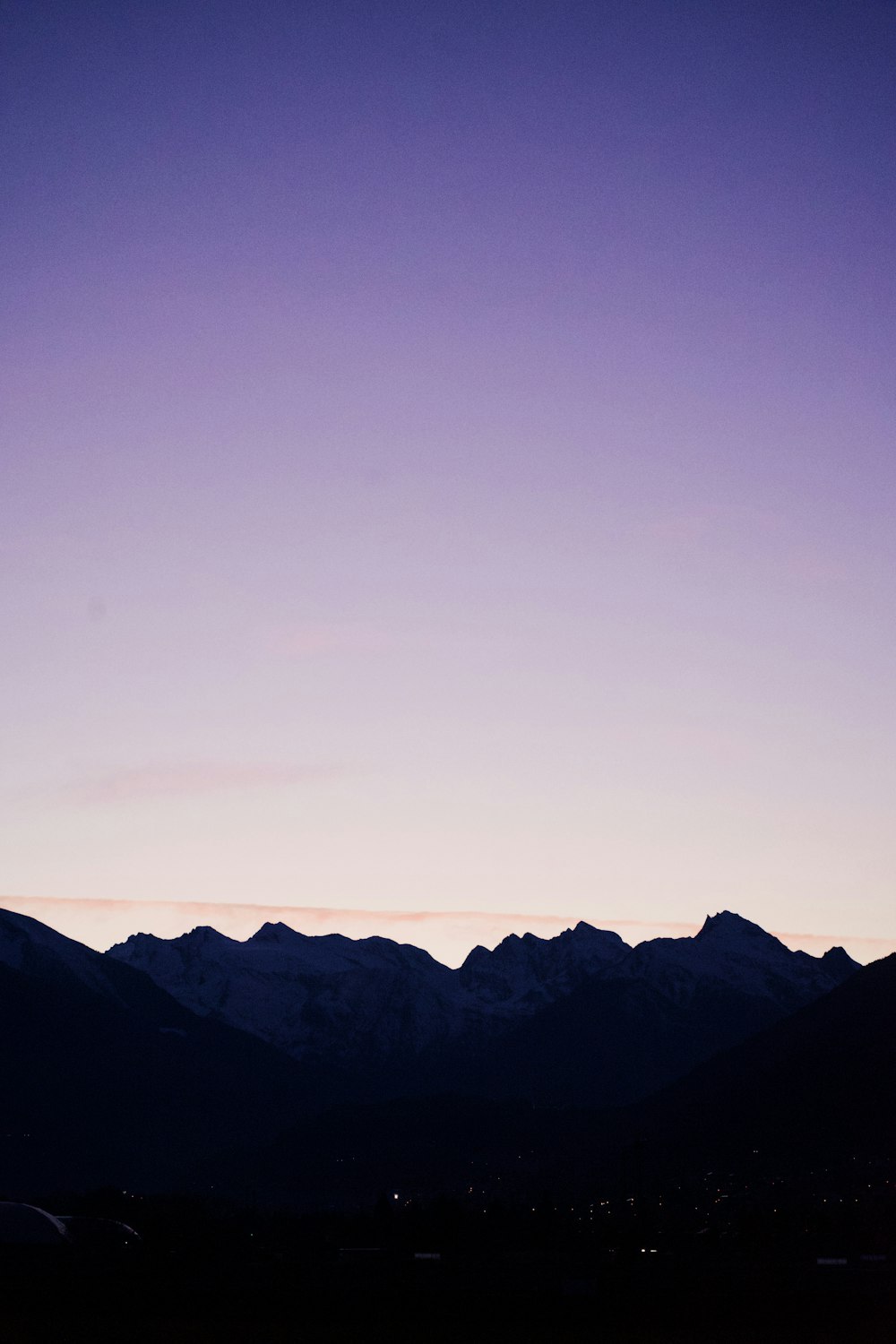 a view of a mountain range at dusk