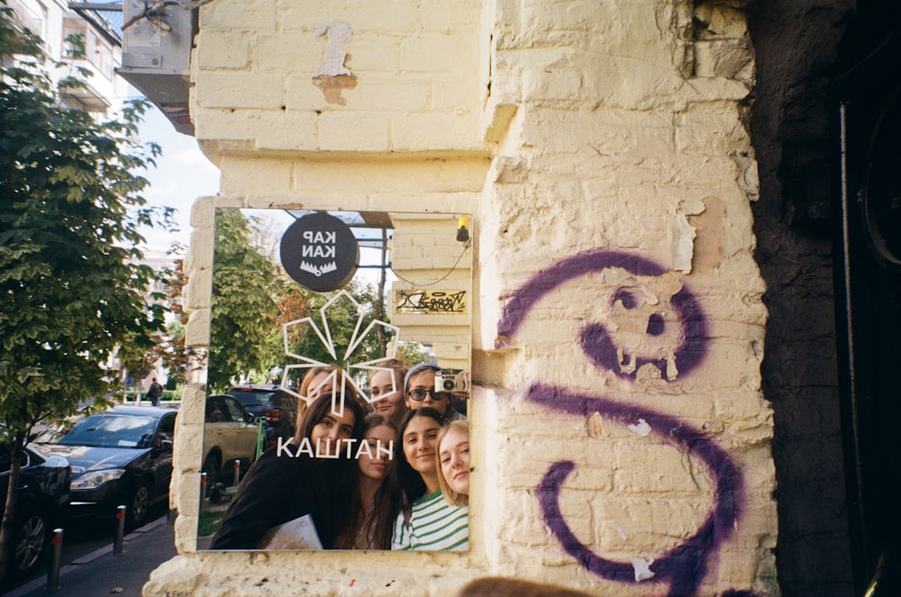 a group of people standing in front of a building