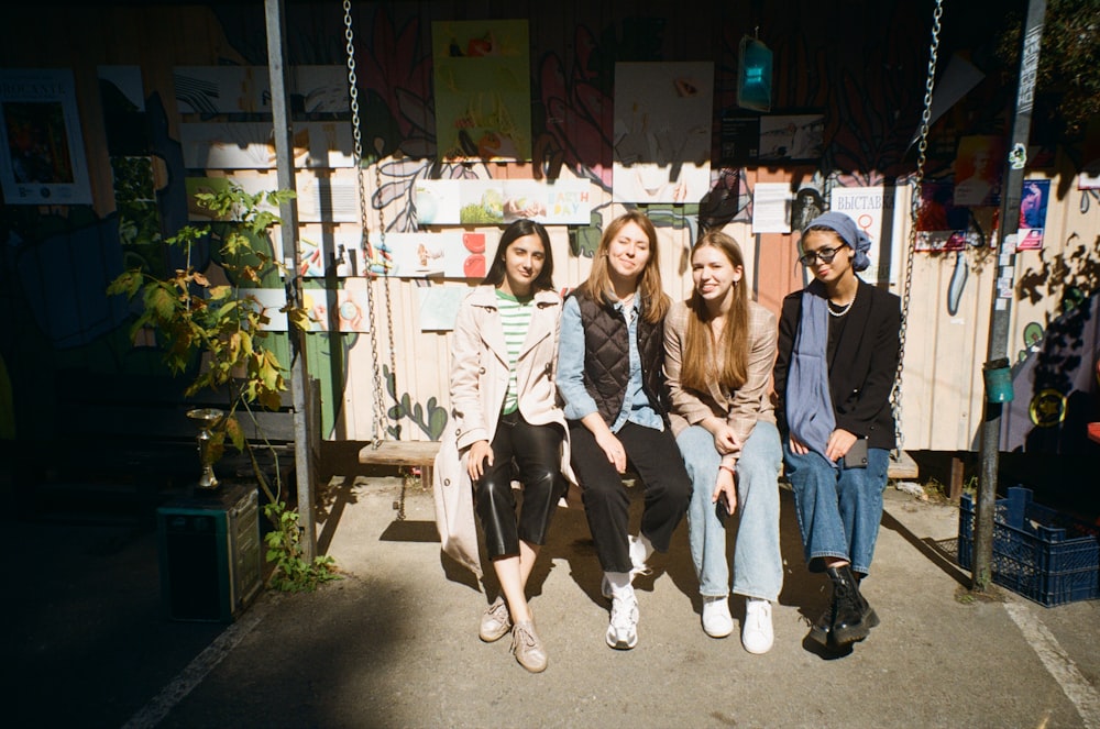 a group of people sitting next to each other