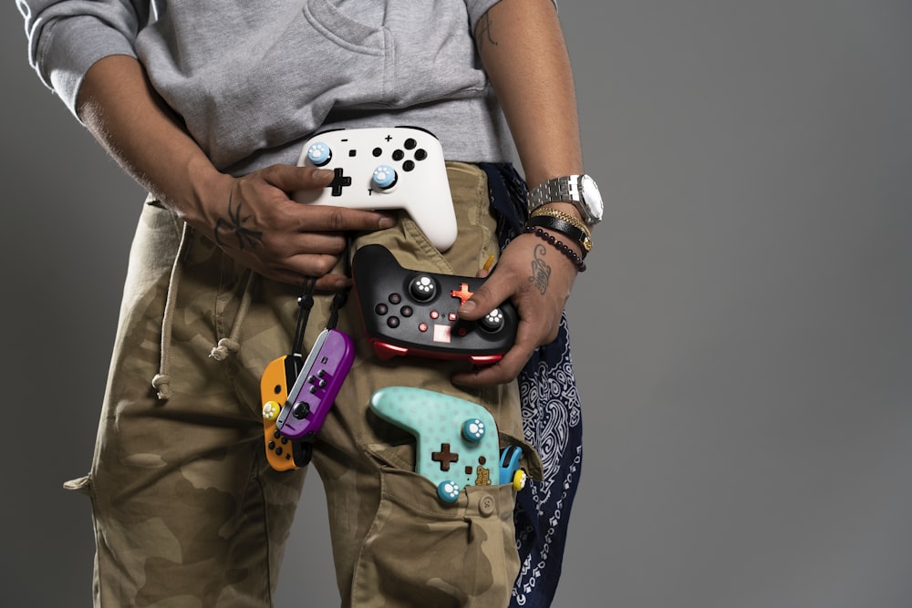 a man is holding a video game controller