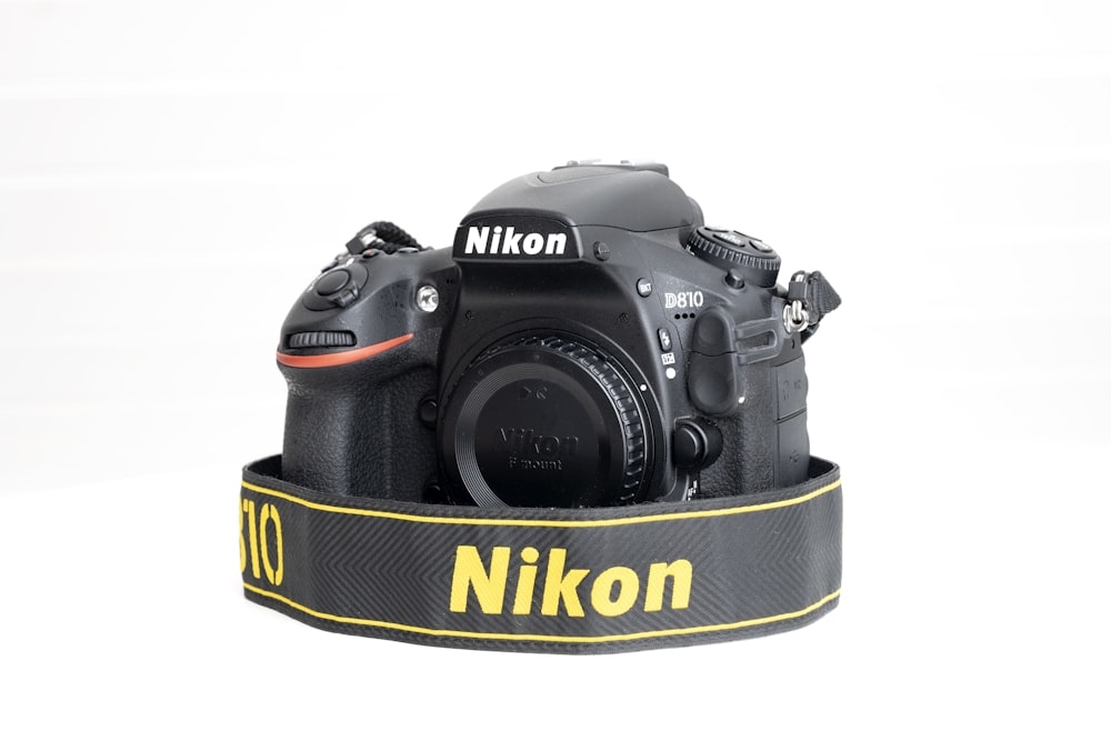 a camera with a nikon strap attached to it