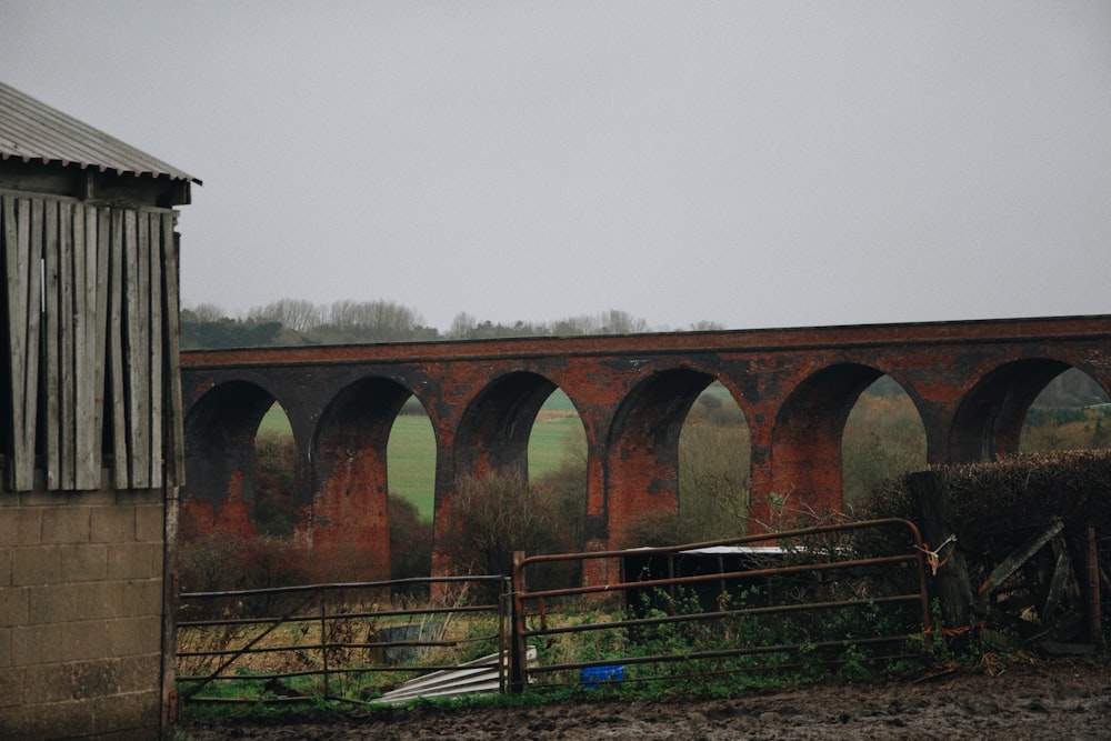 an old brick bridge with arches over it