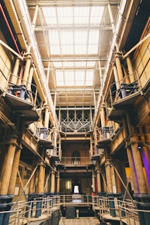 A sleek, modern industrial facility with visible engineering structures and machinery bathed in natural light.