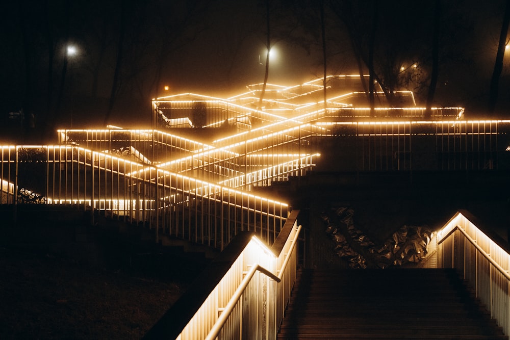 a stairway lit up with lights at night