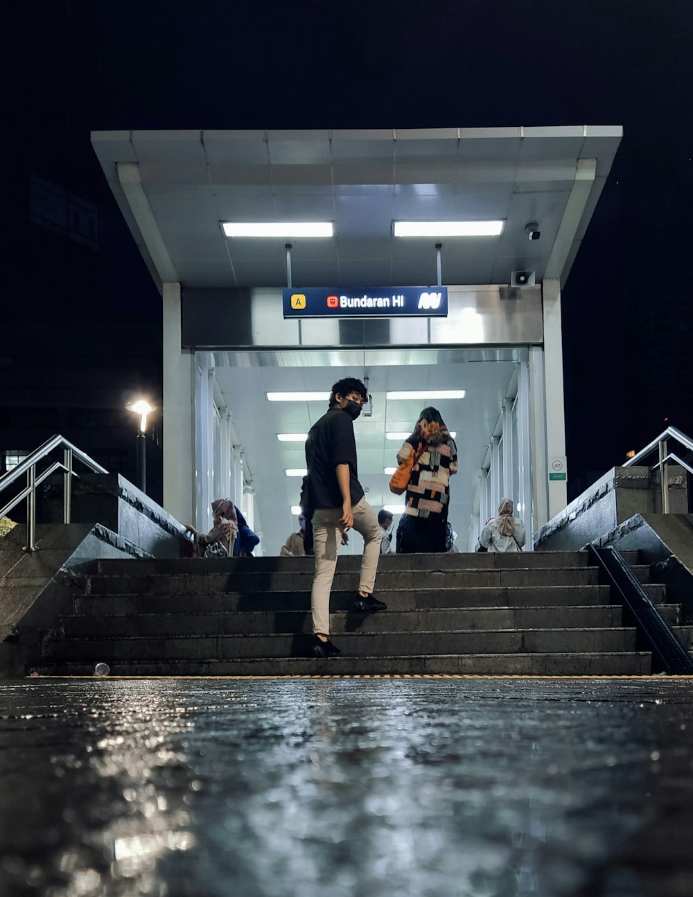 a couple of people that are standing on some steps