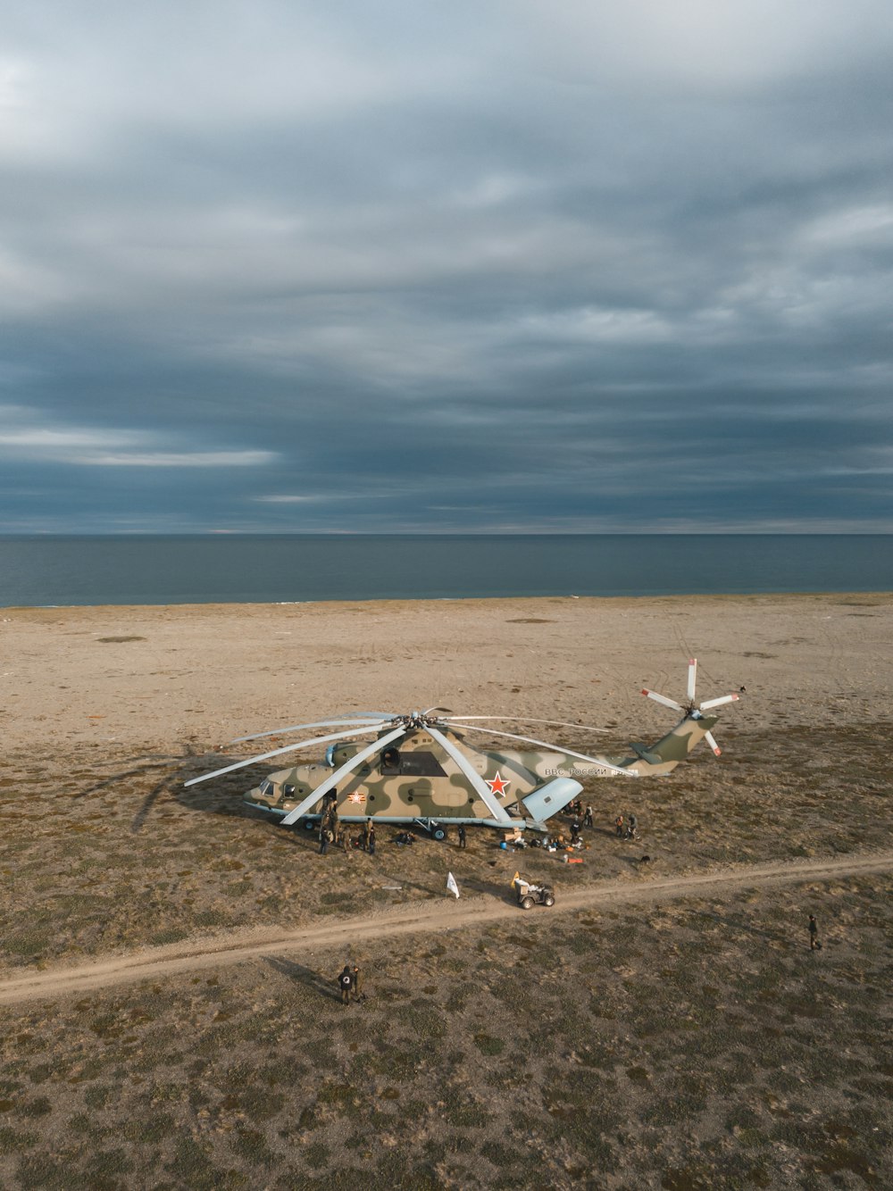 a large airplane sitting on top of a sandy beach