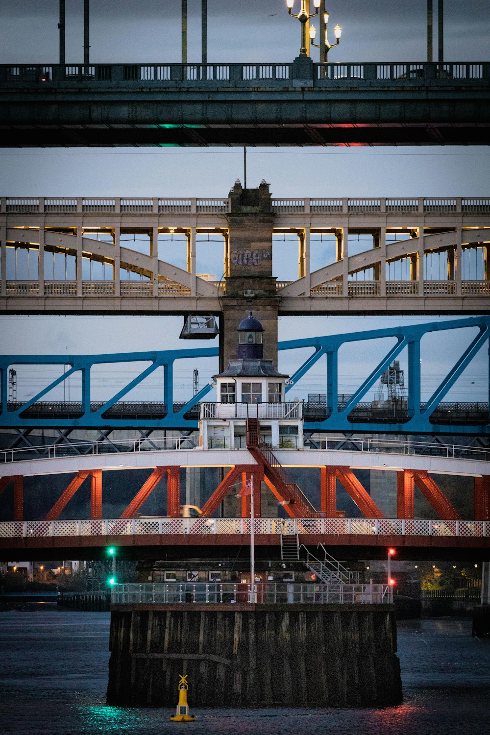 a bridge that has a clock tower on top of it