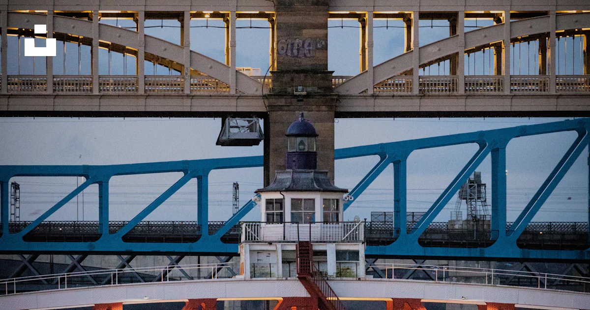 Clock On Bridge A bridge that has a clock tower on top of it photo – Free River Image ...