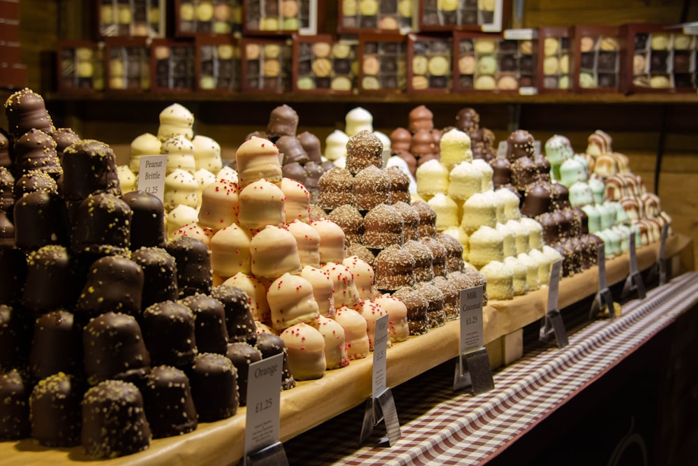 a display case filled with lots of different types of cakes