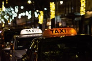 a taxi cab with a taxi sign on top of it
