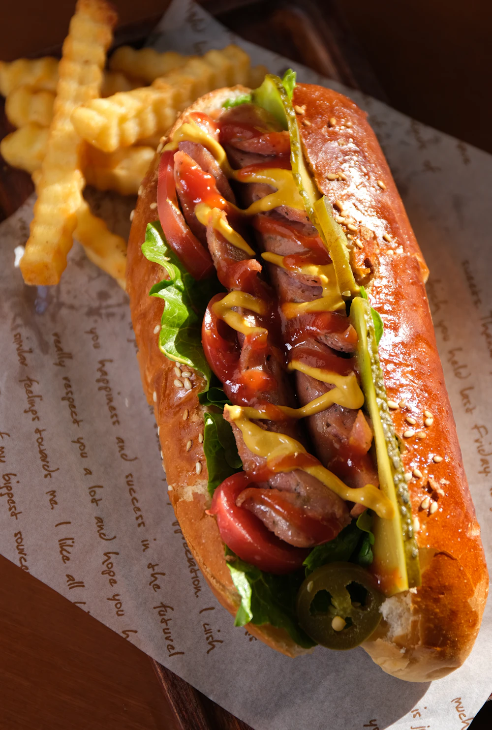 Close-up of a loaded Sonoran hot dog