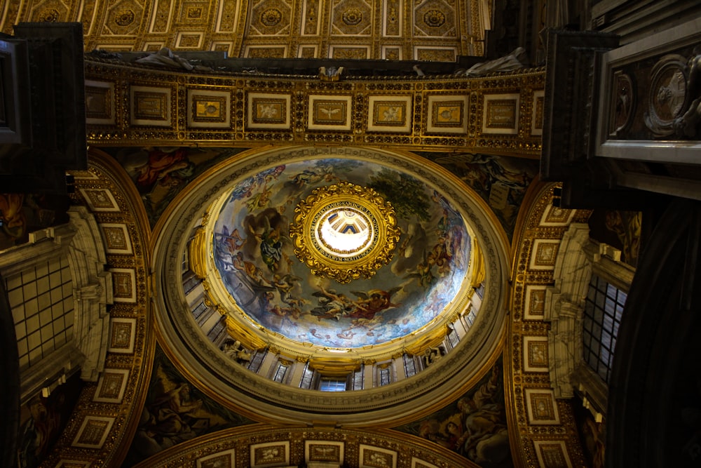 the ceiling of a building with a dome in the center