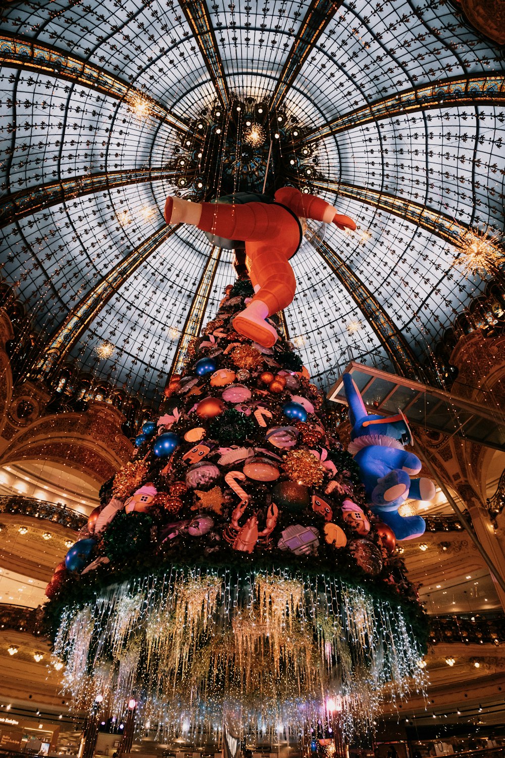 a large christmas tree in a large building