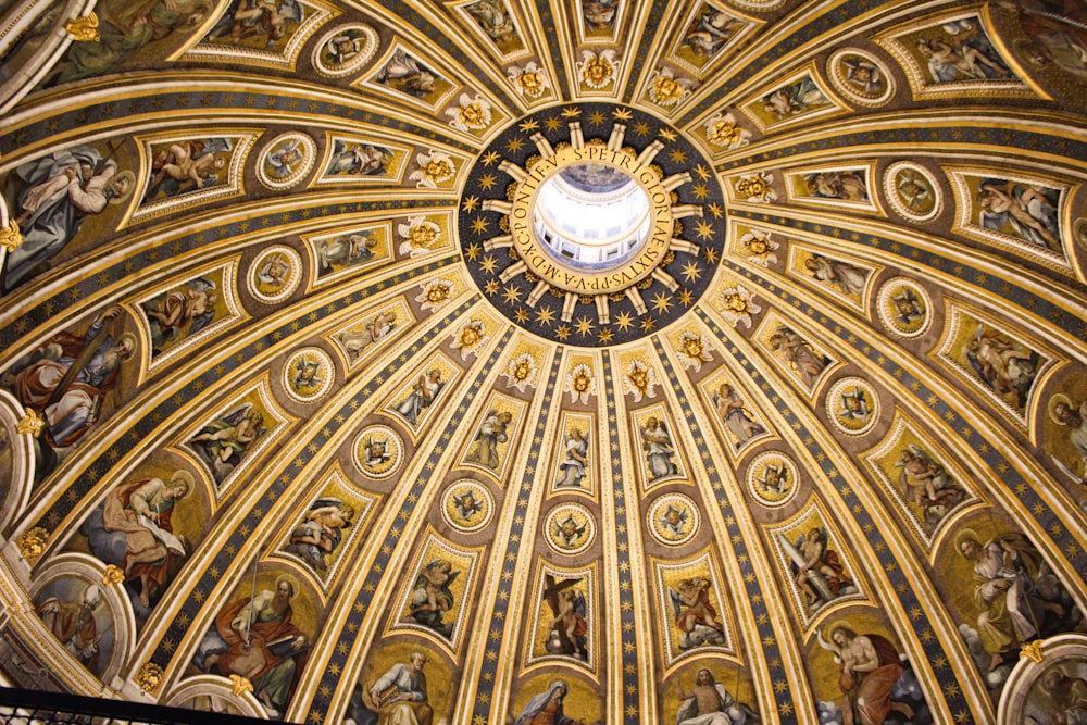 the ceiling of a church with paintings on it