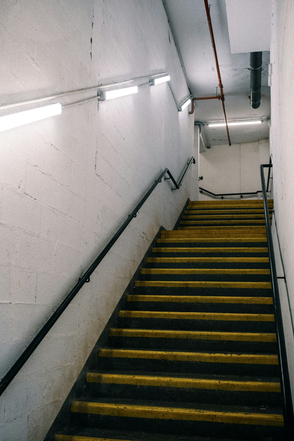 a set of stairs leading up to the top of a flight of stairs