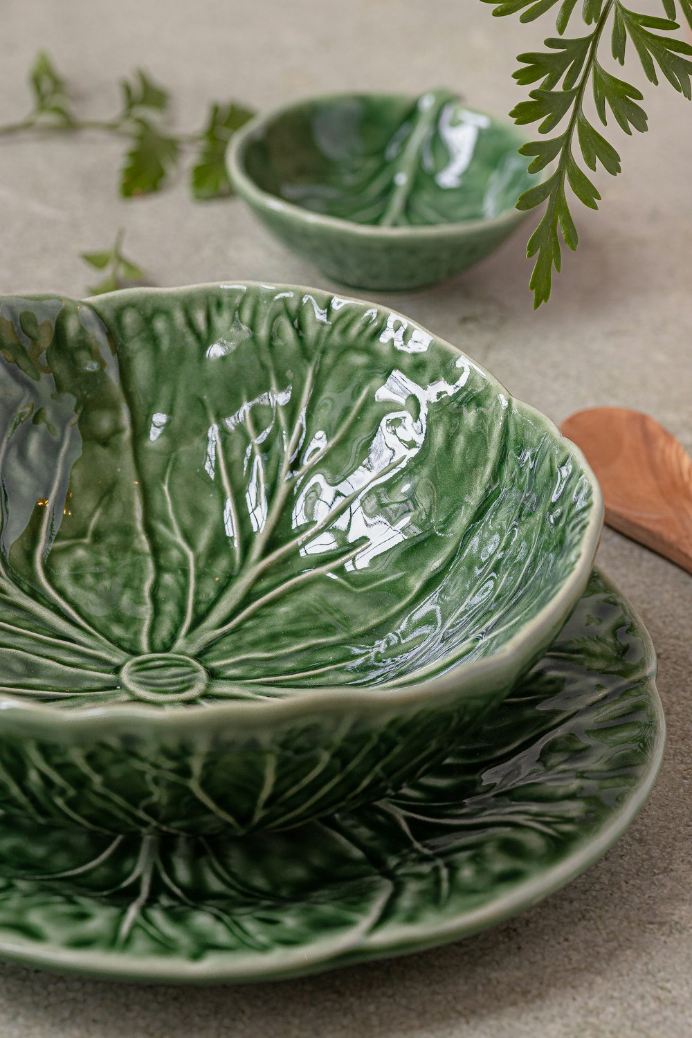 a couple of green bowls sitting on top of a table