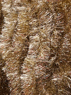 Close-up of shimmering goldflakes ready for packaging at an Aurelia franchise location