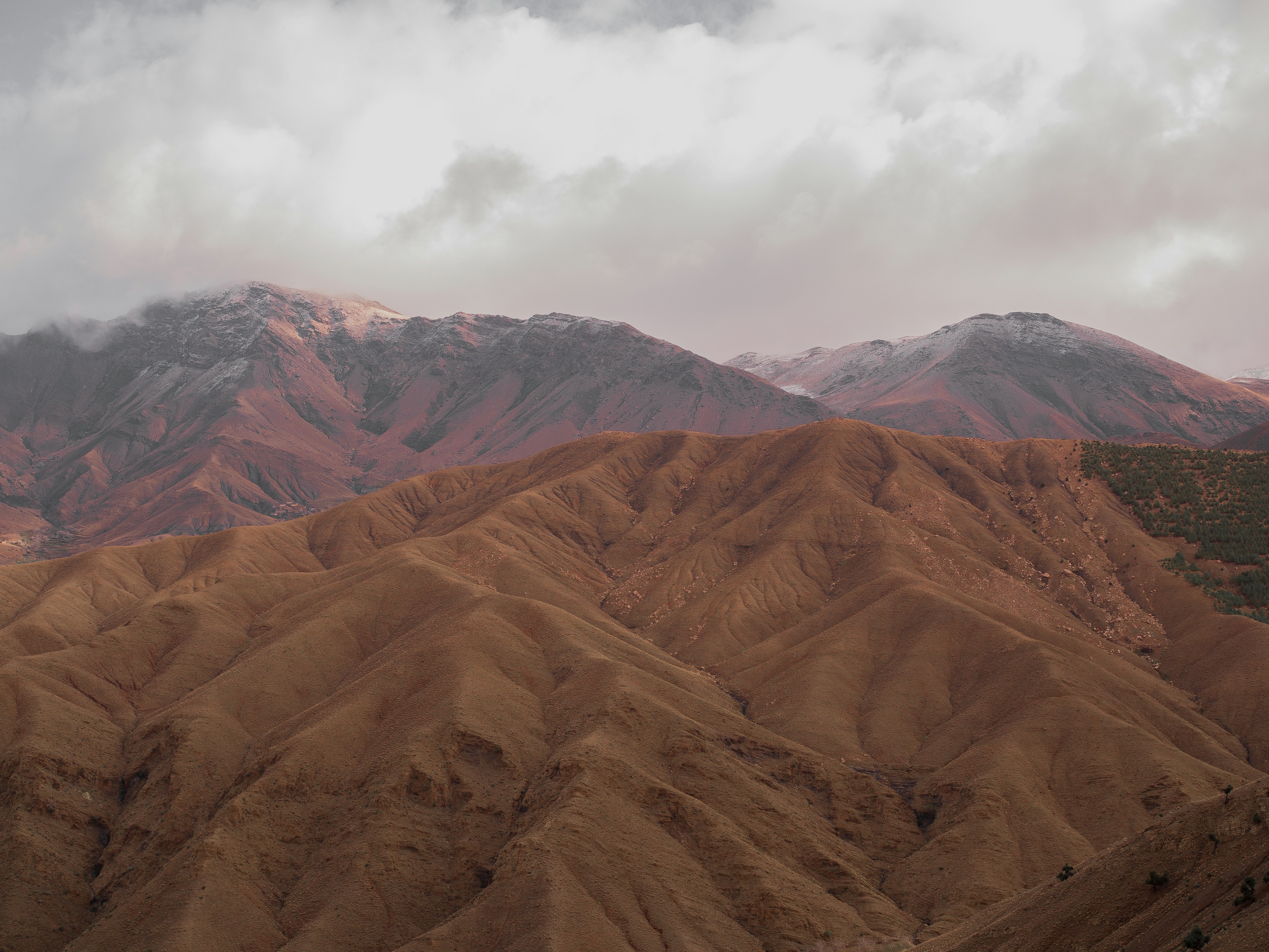 a view of a mountain range with a cloudy sky