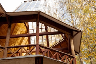 a wooden structure with a glass window on top of it