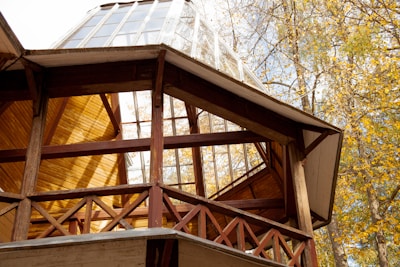 a wooden structure with a glass window on top of it