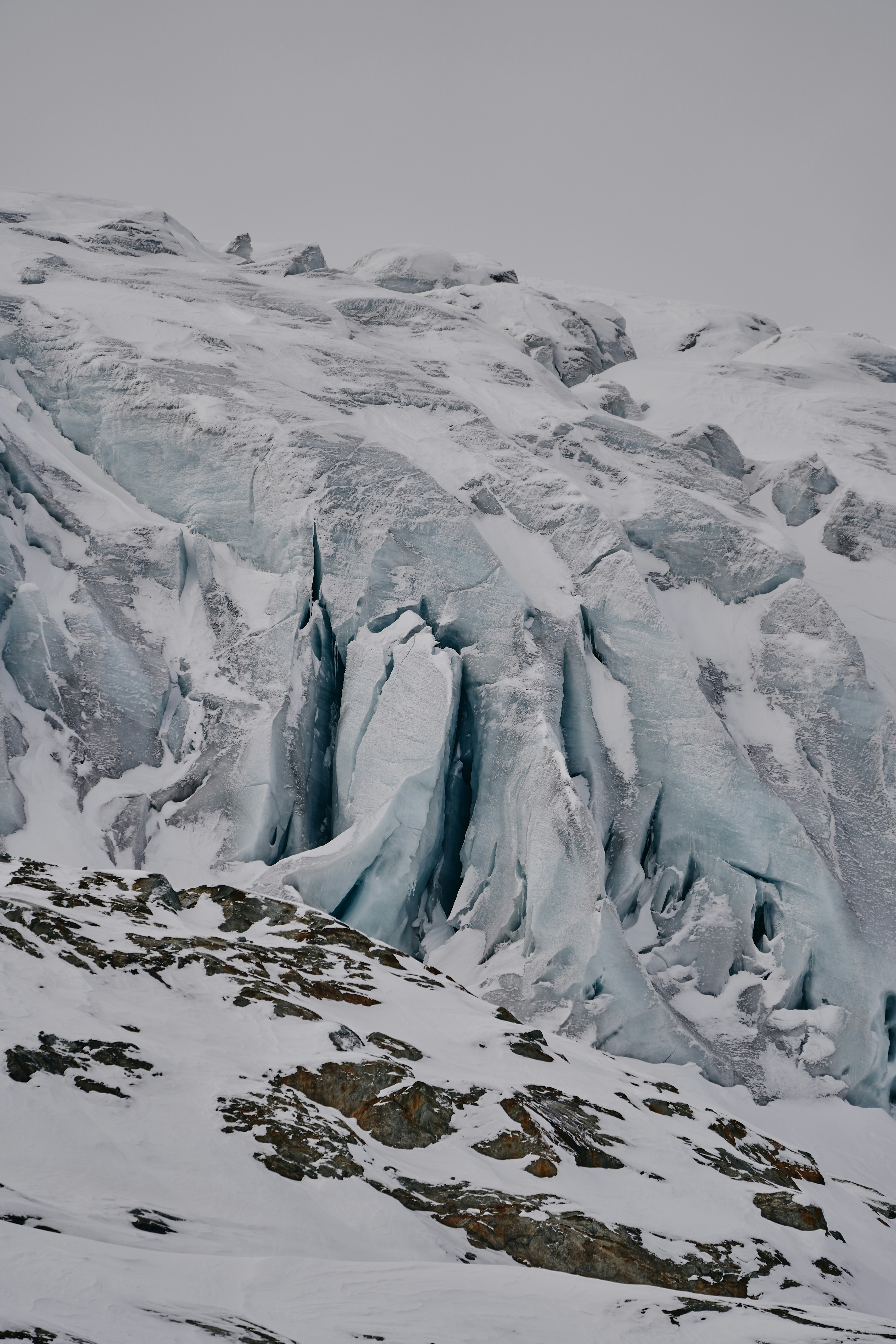 a very tall mountain covered in lots of snow