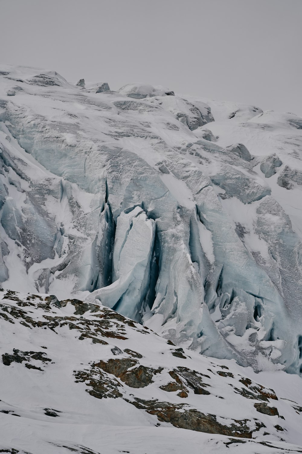 a very tall mountain covered in lots of snow