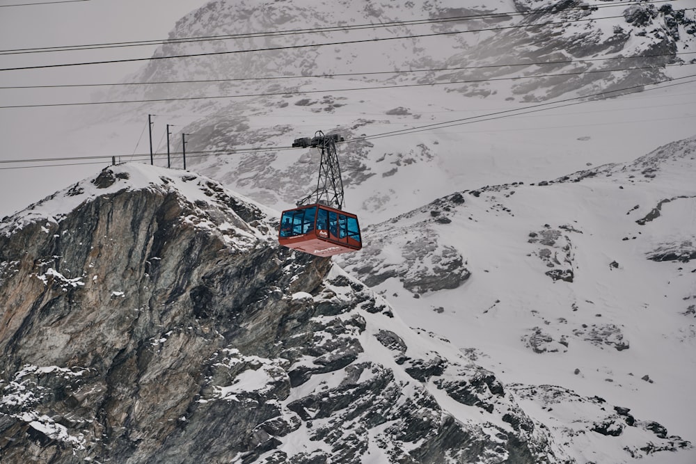 a ski lift going up a snowy mountain