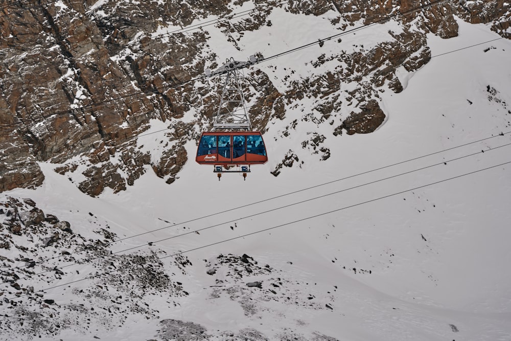 a ski lift going up a snowy mountain