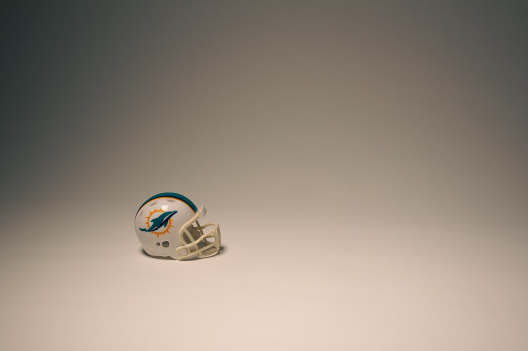 a football helmet sitting on top of a white table,