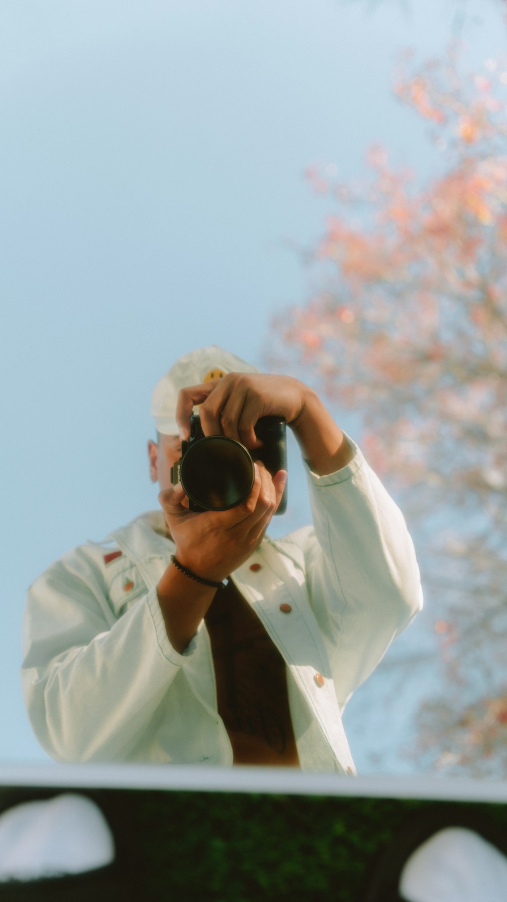 a man taking a picture of himself in a mirror