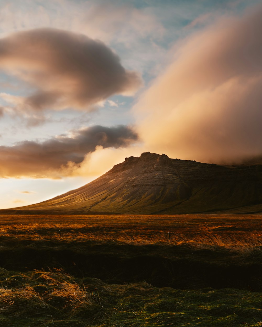 a mountain with a cloud in the sky